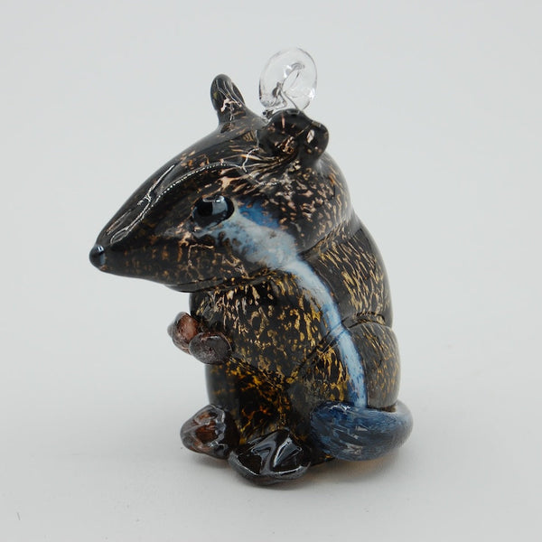 Blown glass chipmunk ornament on a white background